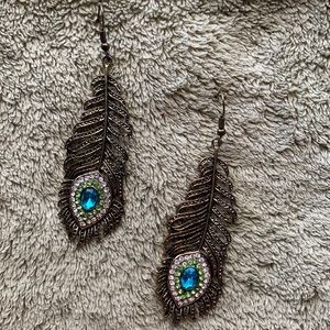 Long dangle peacock earrings with charming blue, green, clear gems.